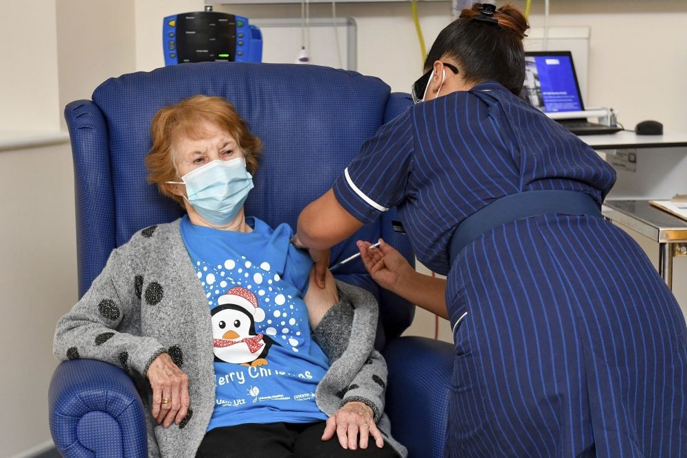 Coventry: 90 year old Margaret Keenan, the first patient in the UK to receive the Pfizer-BioNTech COVID-19 vaccine, administered by nurse May Parsons at University Hospital, Coventry, England, Tuesday Dec. 8, 2020. The United Kingdom, one of the countries hardest hit by the coronavirus, is beginning its vaccination campaign, a key step toward eventually ending the pandemic.AP/PTI
